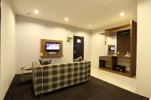 A television and/or entertainment centre at S Boutique Hotel