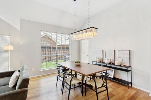 a dining room with a table and chairs at Family Fun Retreat- Pool & Entertainment Haven! home in Frisco