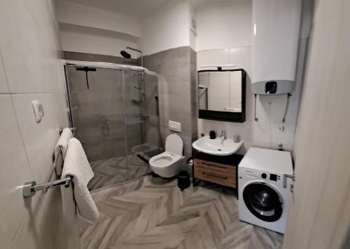 a bathroom with a shower and a toilet and a sink at Villa Zdenko in Omiš