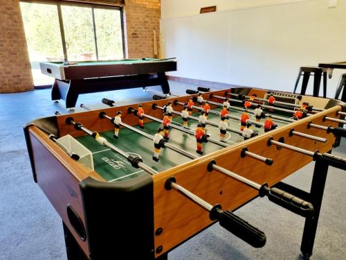 a foosball table with at The Timboon Villa - 5 bedroom home in Timboon