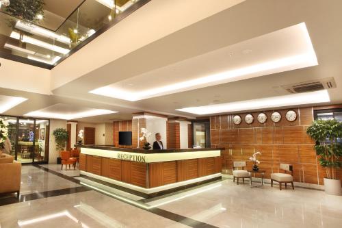 a lobby with a reception desk in a building at Mard-inn Hotel in Istanbul
