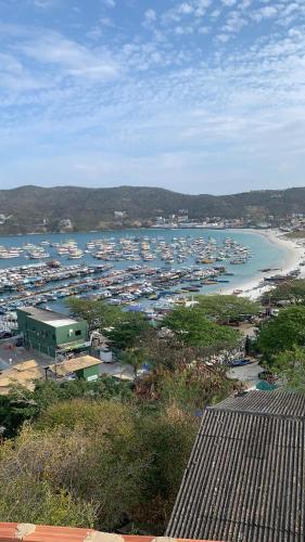 a view of a harbor with boats in the water at Casa incrível praia dos anjos in Arraial do Cabo