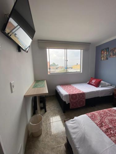 Кровать или кровати в номере Hotel Boutique Casa Magaly