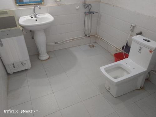 a bathroom with a toilet and a sink at Eagle nest in Tipaza
