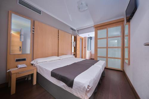 Katil atau katil-katil dalam bilik di Hotel Faro Salazón