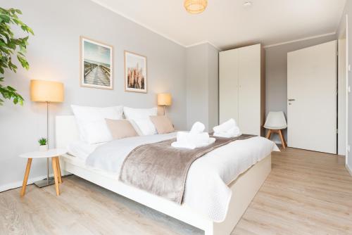Postel nebo postele na pokoji v ubytování Idyllische Ferienwohnung am Schaalsee - Natur und Erholung pur
