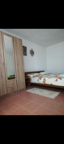 a bedroom with two bunk beds and a mirror at Pavlović in Međugorje