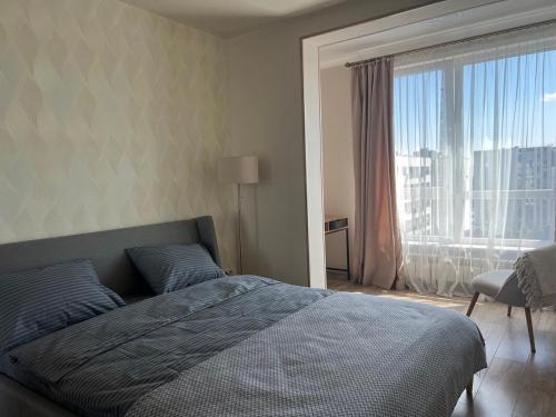 Кровать или кровати в номере Apartments VIP AVALON