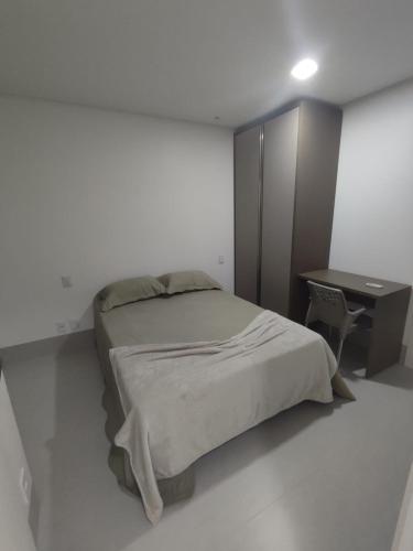 Postel nebo postele na pokoji v ubytování Ap 2 4 com suíte Edifício City House