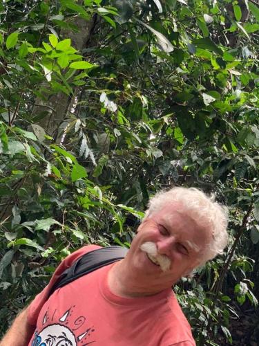 an older man with a moustache at Wisma Batu Mandi in Bukit Lawang