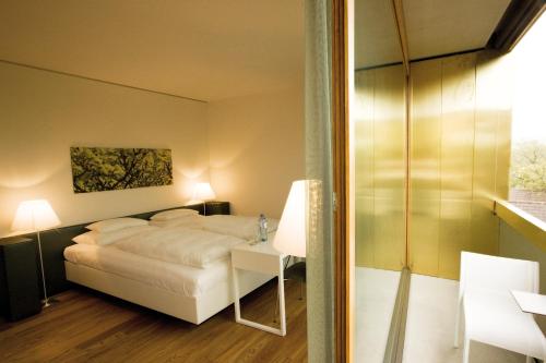 Krevet ili kreveti u jedinici u okviru objekta Hotel am See