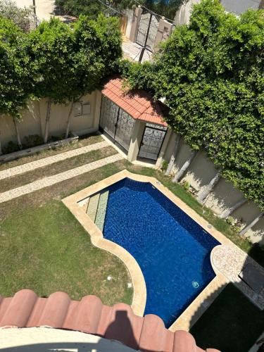 an overhead view of a swimming pool in a yard at Relaxing Villa with private pool in King Mariout