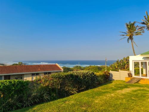 a view of the ocean from the backyard of a house at Syringa Sea View in Pennington