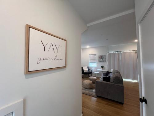 a living room with a couch and a picture on the wall at Minutes to Rock City, Ruby Falls, & Downtown in Chattanooga