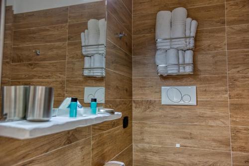 a bathroom with a shower with a sink and a mirror at B&B Filangieri in Naples