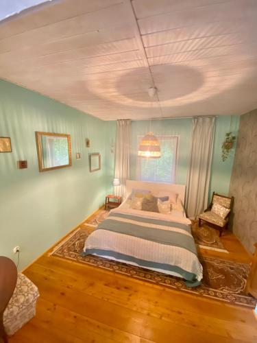 a bedroom with a large bed in a room at Na samotě U Včelína in Lančov