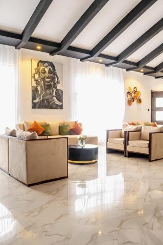 a living room with a couch and a table at Avian Court Hotel in Naivasha