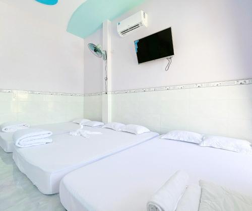 Katil atau katil-katil dalam bilik di Quoc Dinh Guest House