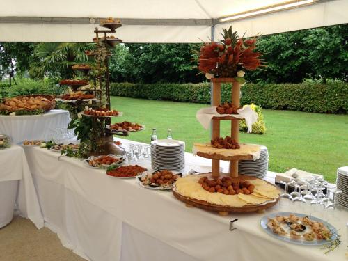 a table with a buffet of food on it at Agriturismo Al Buttasella in Lavariano