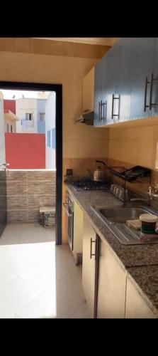 a kitchen with a sink and a counter top at Tetouan Martil in Martil