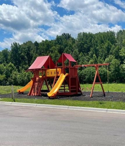 a playground with two slides and a play structure at Stonecrest 910, 2bd Apt I Free Parking I Pool in New Albany