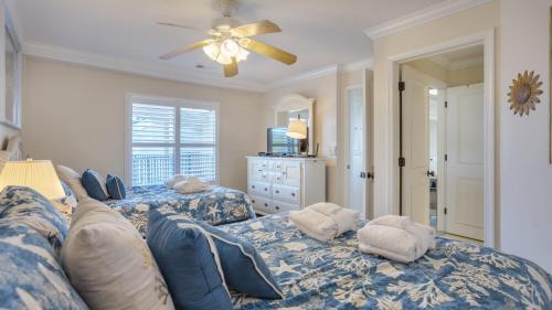 a bedroom with two beds and a ceiling fan at Oceanfront, Luxury Getaway, Bikes in Hilton Head Island