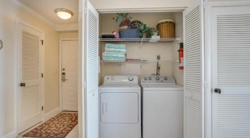 a laundry room with a washer and dryer at Oceanfront, Luxury Getaway, Bikes in Hilton Head Island