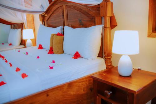 Postel nebo postele na pokoji v ubytování Mambo Ocean Resort