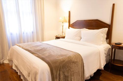 Кровать или кровати в номере Hotel Solar do Rosário