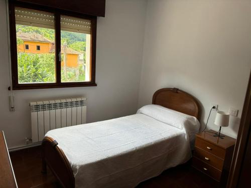 a bedroom with a bed and a window at San Salvador 11 in La Plaza