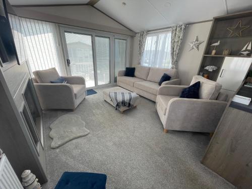 a living room with two couches and two chairs at Coastguard 45 in Whitstable