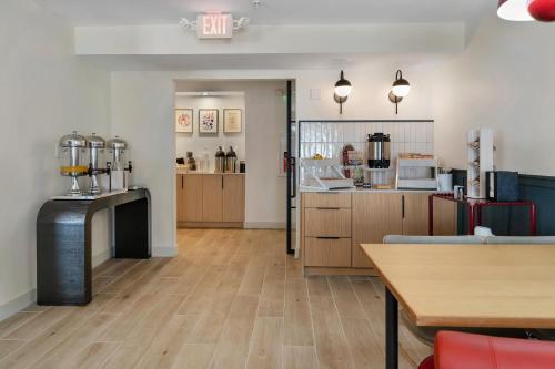 a large room with a kitchen and a dining room at BOB Hotels Tallahassee - Boutique on Budget in Tallahassee