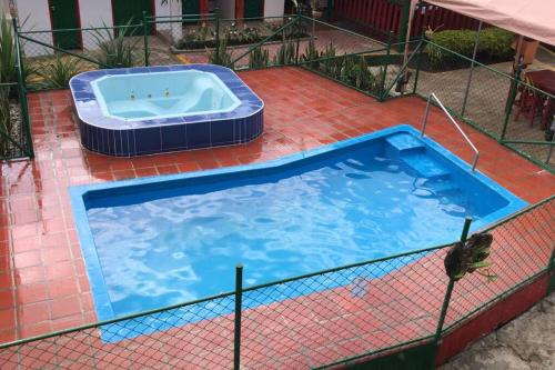 a large swimming pool with at Hospedaje San Martin - Finca completa - 18 personas in Pavas