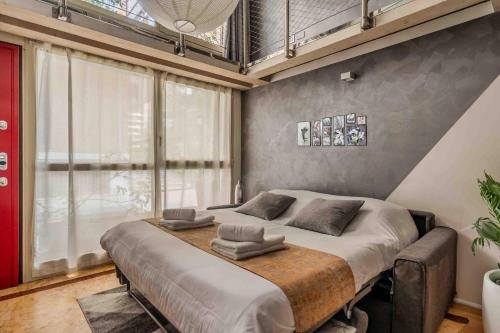 Voodi või voodid majutusasutuse Loft Elegante in Centro Milano In zona Signorile - Davanti alla Metro toas