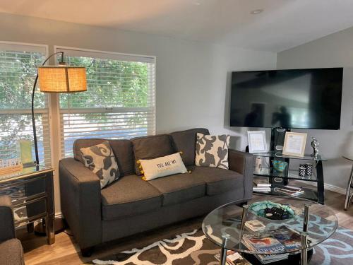 a living room with a couch and a glass table at Sedona Red Rock Garden of Paradise Pets friendly and Hot tub in Sedona