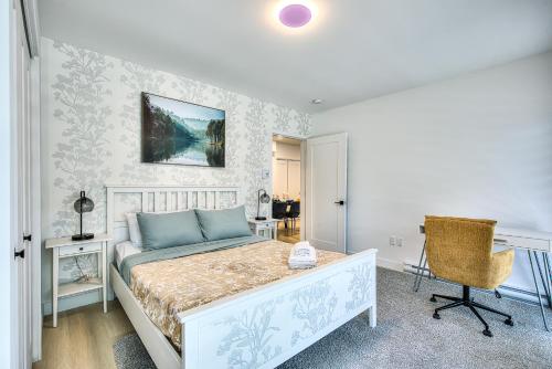 a bedroom with a bed and a desk and a chair at Montreal Restful Nights, Adventure Days await! in Montréal