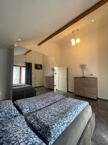 a large bedroom with two beds and a dresser at Charmante Ferienwohnung im Herzen Tirols in Hatting