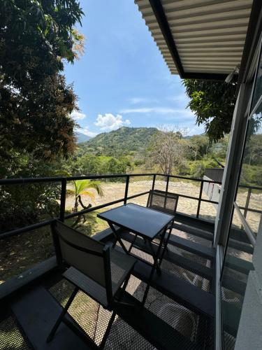 a table and chairs on a balcony with a view at Villa Cristina San Javier in La Mesa