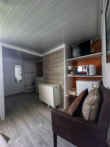a living room with a couch and a chair at Habitación Namasté in Playa Blanca