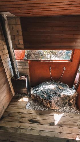 an inside view of a bed in a cabin at Vila Abaton in Alto Paraíso de Goiás