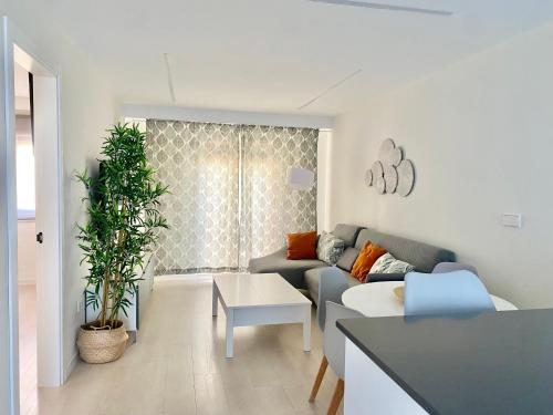 a living room with a couch and a table at Apartamento Andalucía Centro in Antequera