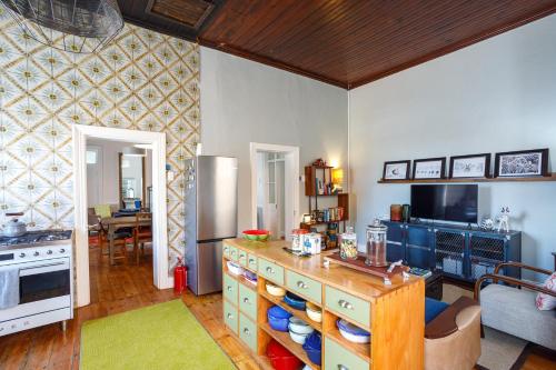 a kitchen with a table and a counter top at Rus In De Rust in De Rust