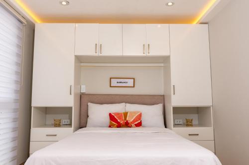 Ένα ή περισσότερα κρεβάτια σε δωμάτιο στο Private Residences by Vibrant