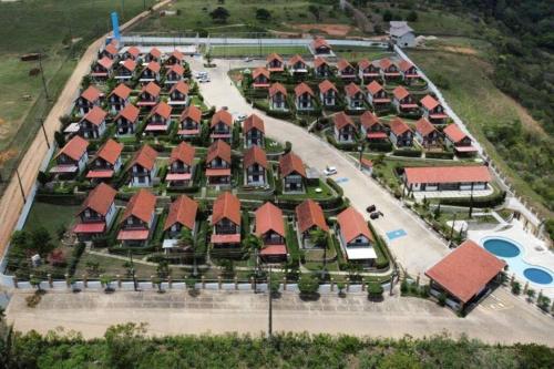 an overhead view of a row of houses with red roofs at Bananeiras - Chalé 204 in Bananeiras