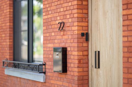a brick building with a door with the number twelve at Chill Hill in Hasselt