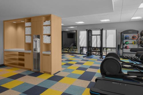 a gym with treadmills and chairs in a room at TownePlace Suites by Marriott Coeur d'Alene in Coeur d'Alene