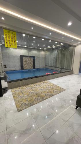 a gym with a trampoline in a building at Kinda Resort Luxury Villas in Taif