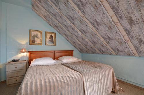 Katil atau katil-katil dalam bilik di Dworek nad Regą