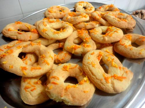 a pile of donuts with orange sprinkles on a plate at Tenuta Montelaura in Forino