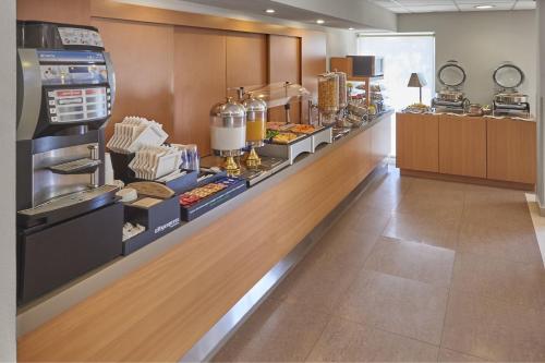 a buffet line in a restaurant with food at City Express by Marriott Mazatlan in Mazatlán